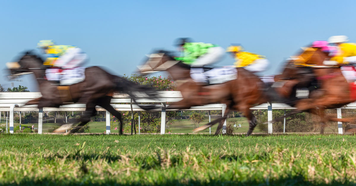 blurred horse racing